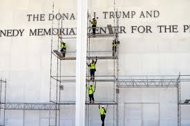 Workers begin to remove Trump’s name from the Kennedy Center, in photos