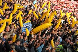 Man City fans in show of defiance by bringing thousands of INFLATABLE BANANAS to Anfield for fiery Liverpool game — The Sun