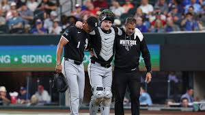 Teel helped off the field after left ankle injury during play at plate