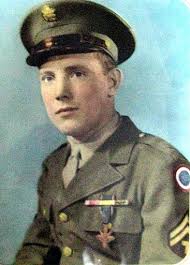 Sgt. Sam Burns wearing the Distinguished Service Cross, the second higest medal for bravery, on his breast pocket. Directly above is a ribbon noting he took ... - sam-burns-portrait