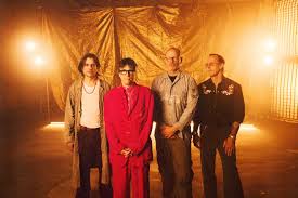 Weezer Preview Self-Titled Album With 'We Might As Well Be Strangers' Featuring Wednesday