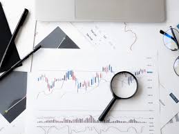 analytics graph with a magnifying glass