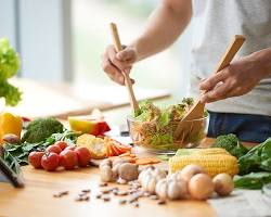 Image of person cooking a healthy meal at home