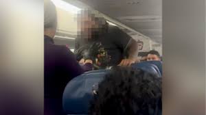 Unruly passenger did not access cockpit on Atlanta-bound aircraft, leading back to diversion to Hobby Airport, officials say.