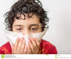 Boy with a runny nose. Dust allergy. Kid - hispanic-child-blowing-his-nose-boy-runny-nose-dust-allergy-kid-suffering-cold-curly-hair-flu-seasonal-virus-33426731