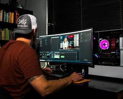 person editing a video on a computer resmi