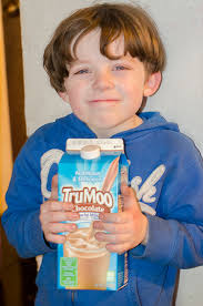 Christopher holding Trumoo. We like to keep a carton of the TruMoo Chocolate Milk in our fridge. What I like about this chocolate milk is that it has NO ... - christopher-trumoo