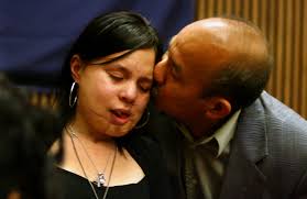 Gus Chan/The Plain DealerJohanna Orozco gets a kiss from her grandfather, Wosbely, after speaking at the sentencing of Juan Ruiz Wednesday. - johanna01