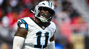 Panthers' Scourton carted off with knee injury on 1st day of camp