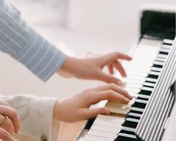 Image of Person teaching music lesson