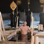 Putin takes Epiphany's plunge with