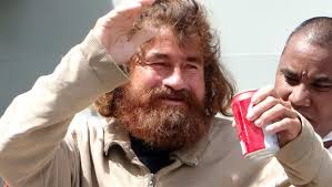 A castaway from Mexico who identified himself as Jose Salvador Alvarenga walks with the help of a nurse in Majuro, Marshall Islands, after a 22-hour boat ... - lost-at-sea-466664881