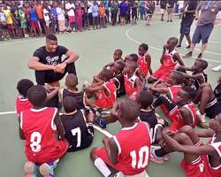 Image of Family playing basketball in a park in Nigeria