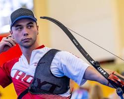 Image of athlete winning the men's individual recurve open