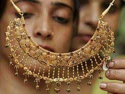 Attractive fin instruments needed to check gold demand: Rajan - 27gold1