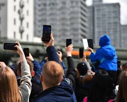 Image of Person taking photos at event