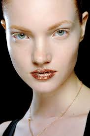 Dior may have tapped into a brand new beauty trend in their fashion show. Models wore sparkling metallic lips courtesy of makeup artist Pat McGrath. - dior-lipstick-fall