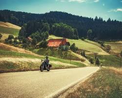 Immagine di motorcycle rider enjoying the view in the Black Forest