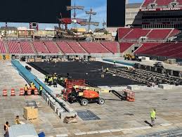 Crews begin transforming field at Raymond James Stadium into ice rink