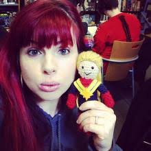 Kelly Sue DeConnick. Kelly Sue with a Captain Marvel yarn doll. The Carol Corps Yarn Brigade are people that are knitters and crocheters. - toucan_deconnick1_cc-yarn