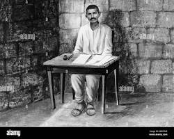 Image of Gandhi writing in prison