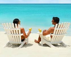 couple relaxing on the beach in Paradise Island, Bahamas