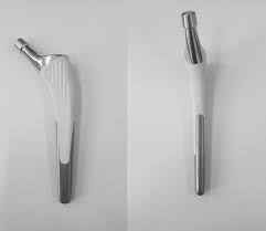 Titanium alloy hip stem with hydroxyapatite which permits ...