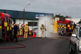 Two Injured Firefighters Rushed to Hospital after Battling Building Fire in West Auckland