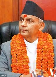 Chief Justice Khil Raj Regmi has been sworn in as Nepal&#39;s new prime minister to head an interim government, which will hold elections by June 21 - article-2313651-19735C53000005DC-975_306x423