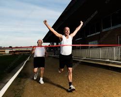 person running towards a finish line