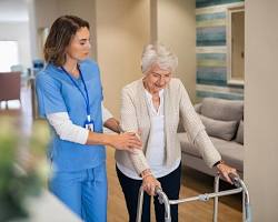 Image of Certified Nursing Assistant helping a patient