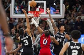 Spurs beat 76ers 115-102 after losing Wembanyama to left rib contusion