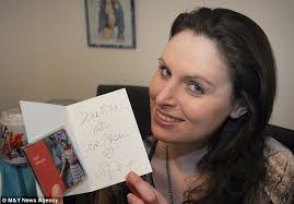 Prized possession: Elle with a 21st birthday card sent to her by the singer and signed &#39;with love from Kylie&#39; - article-2571421-1BF67DE100000578-962_634x441