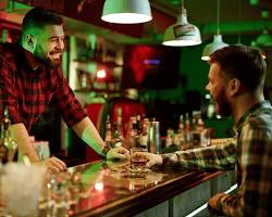 Image of POS system used in a bar by a bar tender