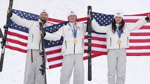 Kuhn, Curran, and Lillis accept gold in mixed team aerials