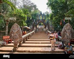Image of Visitors climbing the stairs to Preah Ang Thom Pagoda