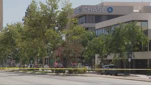 Police negotiate in hostage situation at Chase Bank amid bomb threat in downtown
