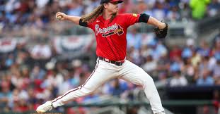Grant Holmes prepares to start for the Atlanta Braves against the Colorado Rockies