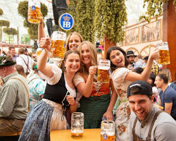 Image de People drinking beer in a beer tent at Oktoberfest