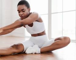 someone doing a hamstring stretch