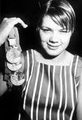 1968 Olympic Games. Mexico City, Mexico. Women&#39;s Swimming. USA&#39;s Debbie Meyer holds the three gold medals she won in the 200, 400 and 800 Metres Freestyle ... - 79025628