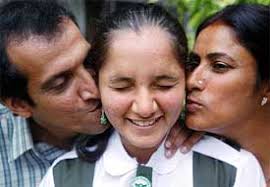 Sania Mirza gets a kiss from her parents, Imran and Naseem Mirza, in Hyderabad on Wednesday. — Reuters photo. In video: (28k, 56k) - sp2