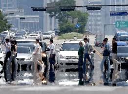 Heatwave and Heavy Rain Hit Korea Despite Seasonal Change