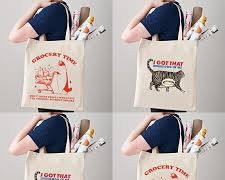 person using a cat canvas tote bag during their commute or school dayの画像