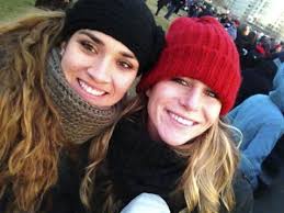 Melanie Daw, left, and Nicole St. Laurent of Edison High School gather near the U.S. Capitol building on the National Mall for the Inauguration ceremony on ... - mh04mo-b781050392z.120130121163633000gka1c4pqn.1