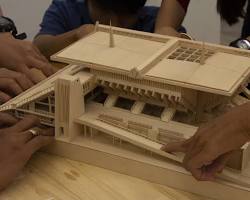 Image of Cambodian model builders working on a project