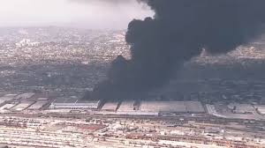 Thick smoke rises from commercial building fire in Boyle Heights