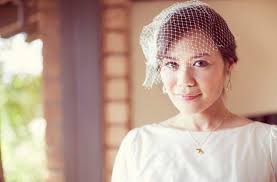 Big thanks to the lovely Annie McElwain for all the photos. bride wearing birdcage veil - mcelwain-wedding-02