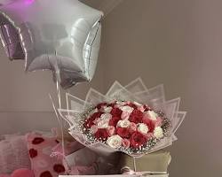 luxury gift hamper with flowers and cake for womens day in lagos, AI generated