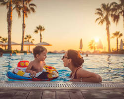happy family at resort poolの画像